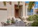 Welcoming front entryway with a decorative security door and covered porch, surrounded by desert landscaping at 16102 E Glenview Dr, Fountain Hills, AZ 85268