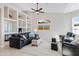 Bright living room with a vaulted ceiling, neutral paint, built-in shelving, and comfortable seating at 16102 E Glenview Dr, Fountain Hills, AZ 85268