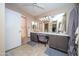 Bright bathroom with double sinks, ample counter space, and neutral tile flooring at 16409 S 46Th St, Phoenix, AZ 85048