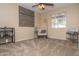 Cozy bedroom with a ceiling fan, chair, and a window that allows natural light to come in at 16409 S 46Th St, Phoenix, AZ 85048