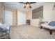 Inviting bedroom features a ceiling fan, a chair, and a shelving unit at 16409 S 46Th St, Phoenix, AZ 85048