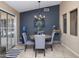 A quaint dining area featuring a modern chandelier, table and chairs adjacent to a glass sliding door at 16409 S 46Th St, Phoenix, AZ 85048