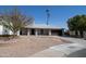 Charming single-story home with desert landscaping and a two-car garage on a sunny day at 16409 S 46Th St, Phoenix, AZ 85048