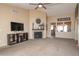 Open living area with modern decor, a fireplace, and a view to the kitchen at 16409 S 46Th St, Phoenix, AZ 85048