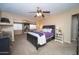 Comfortable primary bedroom featuring neutral tones, a ceiling fan, and adjoining sunroom at 16409 S 46Th St, Phoenix, AZ 85048