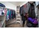 Organized walk-in closet with clothing racks and shelving for storage at 16409 S 46Th St, Phoenix, AZ 85048