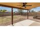 Outdoor patio with ceiling fan provides the perfect spot for relaxing and entertaining in the backyard at 1647 E Christina St, Casa Grande, AZ 85122