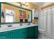 Bathroom featuring dual sinks, a large mirror, and coordinated fixtures at 1647 E Christina St, Casa Grande, AZ 85122