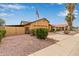 Charming single-story home featuring a neutral-colored exterior, attached garage, and desert landscaping at 1647 E Christina St, Casa Grande, AZ 85122