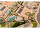 Birds eye view of a beautiful home with a private pool and well-manicured landscaping in a residential neighborhood at 17470 W Gelding Dr, Surprise, AZ 85388