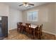 Cozy dining room with a wood table and seating for six at 17470 W Gelding Dr, Surprise, AZ 85388