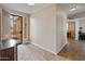 Inviting entryway with tile flooring and natural light with a view to the living room at 17470 W Gelding Dr, Surprise, AZ 85388