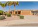 Attractive single-Gathering home, enhanced by palm trees and low-maintenance yard at 17470 W Gelding Dr, Surprise, AZ 85388