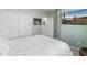 Bright bedroom features a closet and stylish, neutral decor at 18026 W Carmen Dr, Surprise, AZ 85388