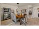 Formal dining area with decorative lighting, a wooden table, and seating for six at 18026 W Carmen Dr, Surprise, AZ 85388