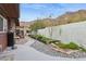 Landscaped backyard featuring a rock garden, a concrete patio and elevated garden beds surrounded by a stucco wall at 1844 E Cinnabar Ave, Phoenix, AZ 85020