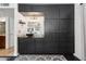 Bathroom with black cabinets and modern sink along with a framed rectangular mirror at 1844 E Cinnabar Ave, Phoenix, AZ 85020