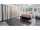 Bedroom featuring a large window, neutral tones, black tile floors and lots of natural light at 1844 E Cinnabar Ave, Phoenix, AZ 85020