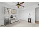 White bedroom with a window view to the desert, closet, and a ceiling fan at 1844 E Cinnabar Ave, Phoenix, AZ 85020