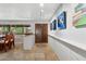 Bright, inviting dining area featuring tile floors, stylish lighting, and unique wall art at 1844 E Cinnabar Ave, Phoenix, AZ 85020