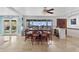 Large dining room with natural lighting, a view to the backyard, and a long wooden dining table at 1844 E Cinnabar Ave, Phoenix, AZ 85020