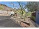 Unique home featuring a xeriscaped yard with cacti and desert flora, set against a mountainous backdrop at 1844 E Cinnabar Ave, Phoenix, AZ 85020