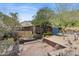 Desert landscaping surrounds an Arizona house with gravel, cacti and natural stone accents at 1844 E Cinnabar Ave, Phoenix, AZ 85020