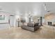 Bright living room featuring a stone fireplace, travertine floors, and sliding glass doors to the outside at 1844 E Cinnabar Ave, Phoenix, AZ 85020