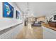 Bright and airy living room featuring tile flooring, modern art, and a stacked stone fireplace at 1844 E Cinnabar Ave, Phoenix, AZ 85020