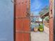 Inviting outdoor patio featuring vibrant planters, a decorative screen, and a glimpse of comfortable seating at 1844 E Cinnabar Ave, Phoenix, AZ 85020