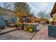 Paver patio showcasing a cozy outdoor living area, complete with stylish seating and potted plants at 1844 E Cinnabar Ave, Phoenix, AZ 85020