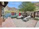 Lush backyard featuring multiple patios, comfortable seating, and artistic accents for tranquil outdoor enjoyment at 1844 E Cinnabar Ave, Phoenix, AZ 85020