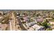 Wide aerial shot of a community featuring lush green spaces, residential homes, and scenic walking paths at 18468 N 63Rd Dr, Glendale, AZ 85308