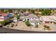 Aerial view of house with desert landscaping, tile roof and convenient circular driveway at 18468 N 63Rd Dr, Glendale, AZ 85308