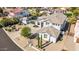 An eye-level exterior front shot showcasing the desert landscaping and beautiful roof at 18468 N 63Rd Dr, Glendale, AZ 85308