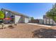 Beautiful backyard with gravel, patio furniture, large gate and plenty of room for outdoor activities at 18468 N 63Rd Dr, Glendale, AZ 85308