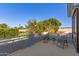 Relaxing balcony space with outdoor seating and views of lush trees at 18468 N 63Rd Dr, Glendale, AZ 85308