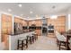 Well-equipped kitchen featuring granite countertops, stainless steel appliances, and bar stool seating at 18468 N 63Rd Dr, Glendale, AZ 85308