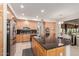 Spacious kitchen featuring a large island with bar seating and stainless steel appliances at 18468 N 63Rd Dr, Glendale, AZ 85308