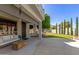 Inviting covered patio with a comfortable seating area overlooking a well-maintained lawn at 18468 N 63Rd Dr, Glendale, AZ 85308