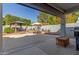 Outdoor patio featuring a dining area, grill, gazebo, and hardscape at 18468 N 63Rd Dr, Glendale, AZ 85308