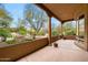 Expansive covered patio boasting scenic desert landscape views with lush plants and interesting rock formations at 18944 E Amethyst Dr, Rio Verde, AZ 85263