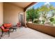 Comfortable covered patio featuring an orange cushioned seating arrangement and scenic outdoor views, great for relaxing at 18944 E Amethyst Dr, Rio Verde, AZ 85263