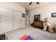 Serene bedroom with soft carpet, spacious closet doors, and a cozy feel, complemented by a ceiling fan at 18944 E Amethyst Dr, Rio Verde, AZ 85263