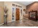 Inviting foyer with wood-look tile, plantation shutters, and classic design at 18944 E Amethyst Dr, Rio Verde, AZ 85263