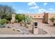 Property featuring a well-maintained desert landscape and an inviting facade at 18944 E Amethyst Dr, Rio Verde, AZ 85263