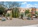 This home features a low-maintenance yard with xeriscaping, native plants, and rocks at 18944 E Amethyst Dr, Rio Verde, AZ 85263