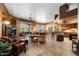 Spacious living room featuring a fireplace, comfortable seating, and abundant natural light at 18944 E Amethyst Dr, Rio Verde, AZ 85263