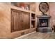 Fireplace with built-ins in a cozy living room enhanced by warm textures at 18944 E Amethyst Dr, Rio Verde, AZ 85263