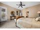 Bedroom featuring carpet, a ceiling fan, and a door to the yard at 18944 E Amethyst Dr, Rio Verde, AZ 85263